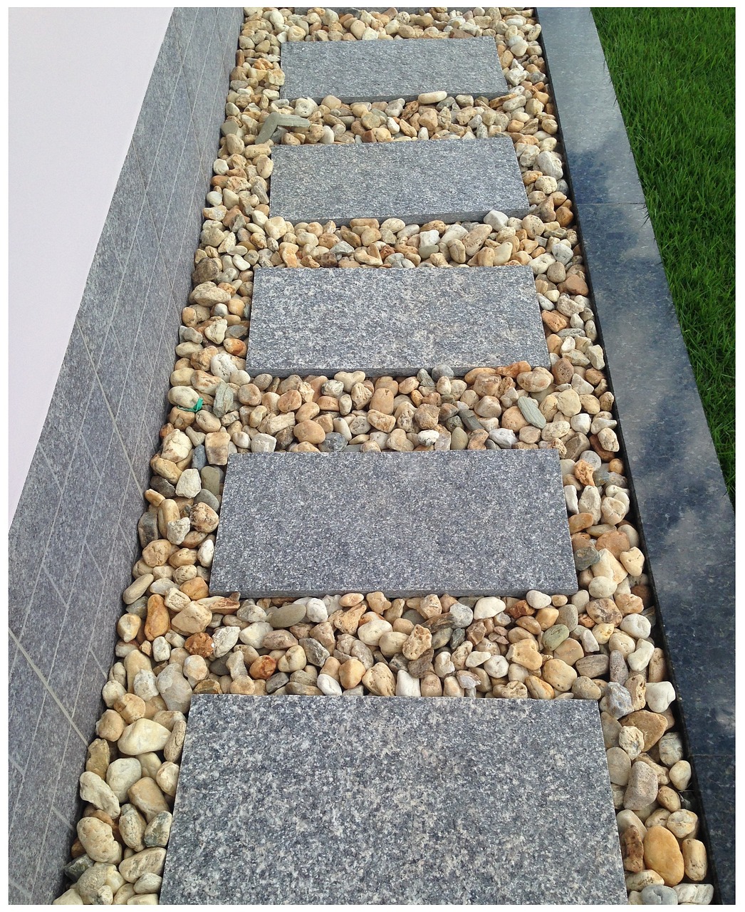 path with square stones surrounded by pebbles