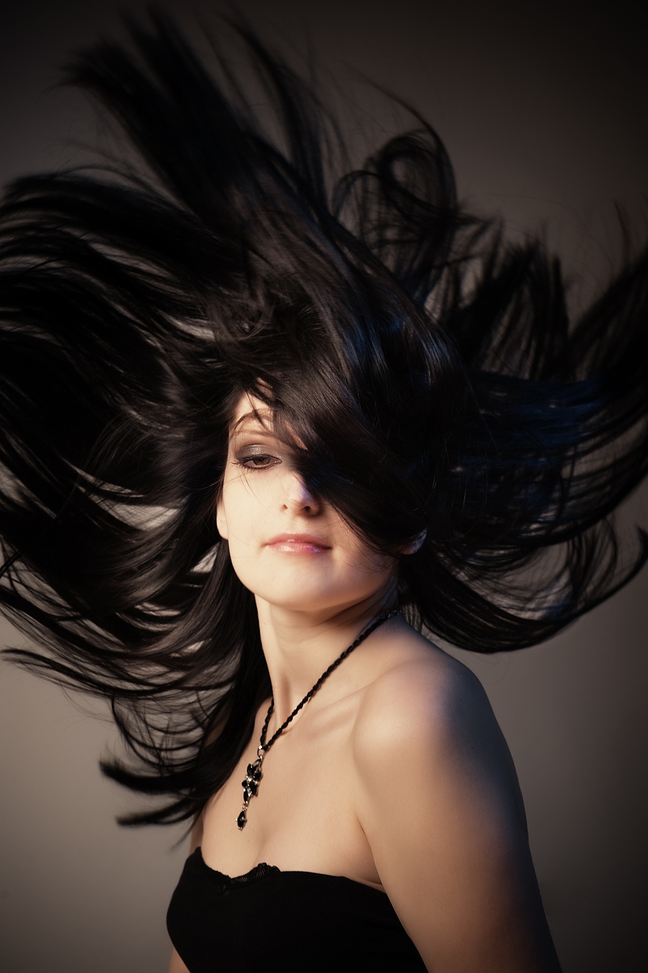 woman with her hair in the air